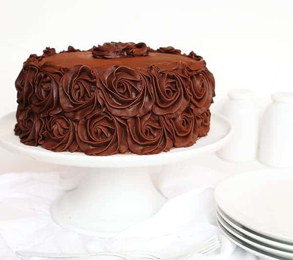 This Perfect chocolate cake has been handed down through generations! Baking, Chocolate Cake, Chocolate Frosting, Cake Decorating, Layer Cake, Dessert, Frosting, i am baker, iambaker, recipes The Perfect Chocolate Cake Recipe and Perfect Chocolate Buttercream on White Cake Stand