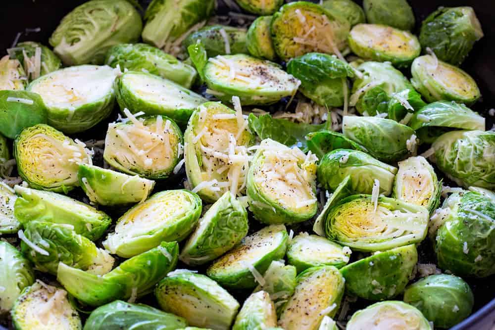 Quite possibly my favorite way to eat Brussel sprouts! They come together FAST and taste AMAZING! #BrusselSprouts #roastedbrusselsprouts #howtoroast #eastervegetable #iambaker Easy Roasted Brussel Sprouts