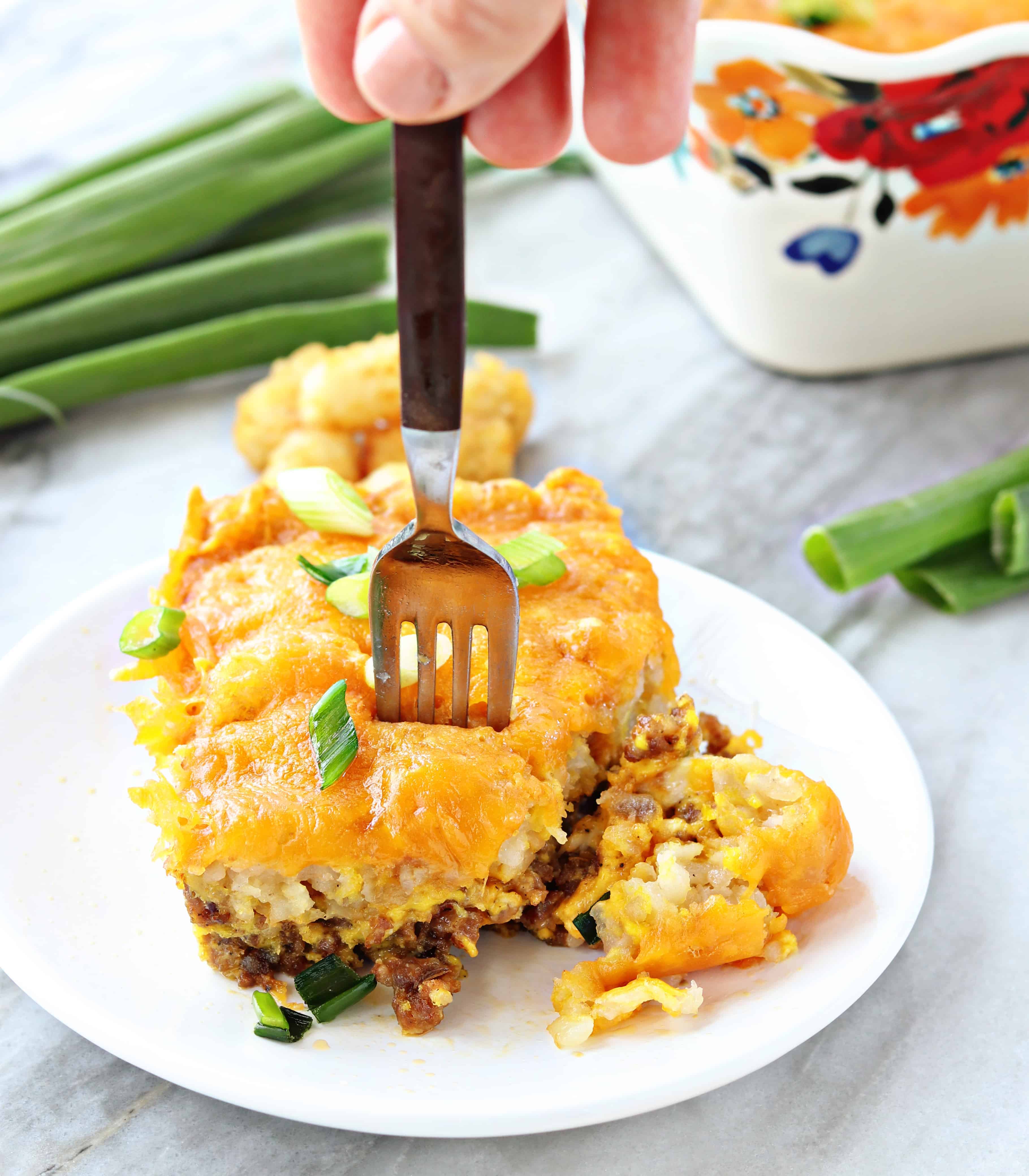 Change up your breakfast routine with this amazing Breakfast Tater Tot Casserole! tater tot hot dish, tater tot casserole, breakfast casserole, breakfast tater tot casserole, tater tots, breakfast recipes, eggs, iambaker Breakfast Tater Top Casserole