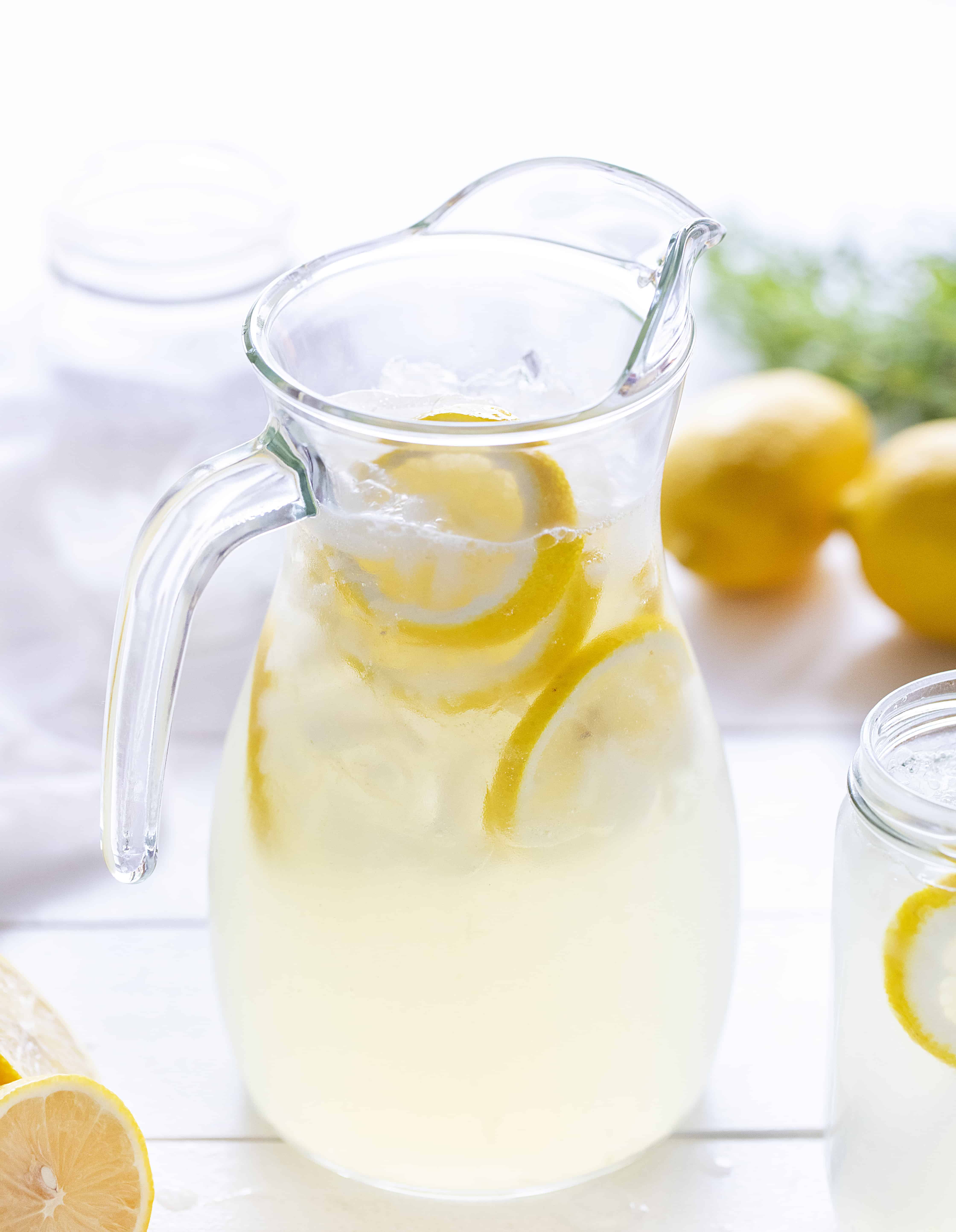 This simple lemonade recipe will be your new go-to drink to beat the heat this summer! #lemonade #homemadelemonade #howtomakelemonade #easylemonade #lemonaderecipe #iambaker Homemade Lemonade