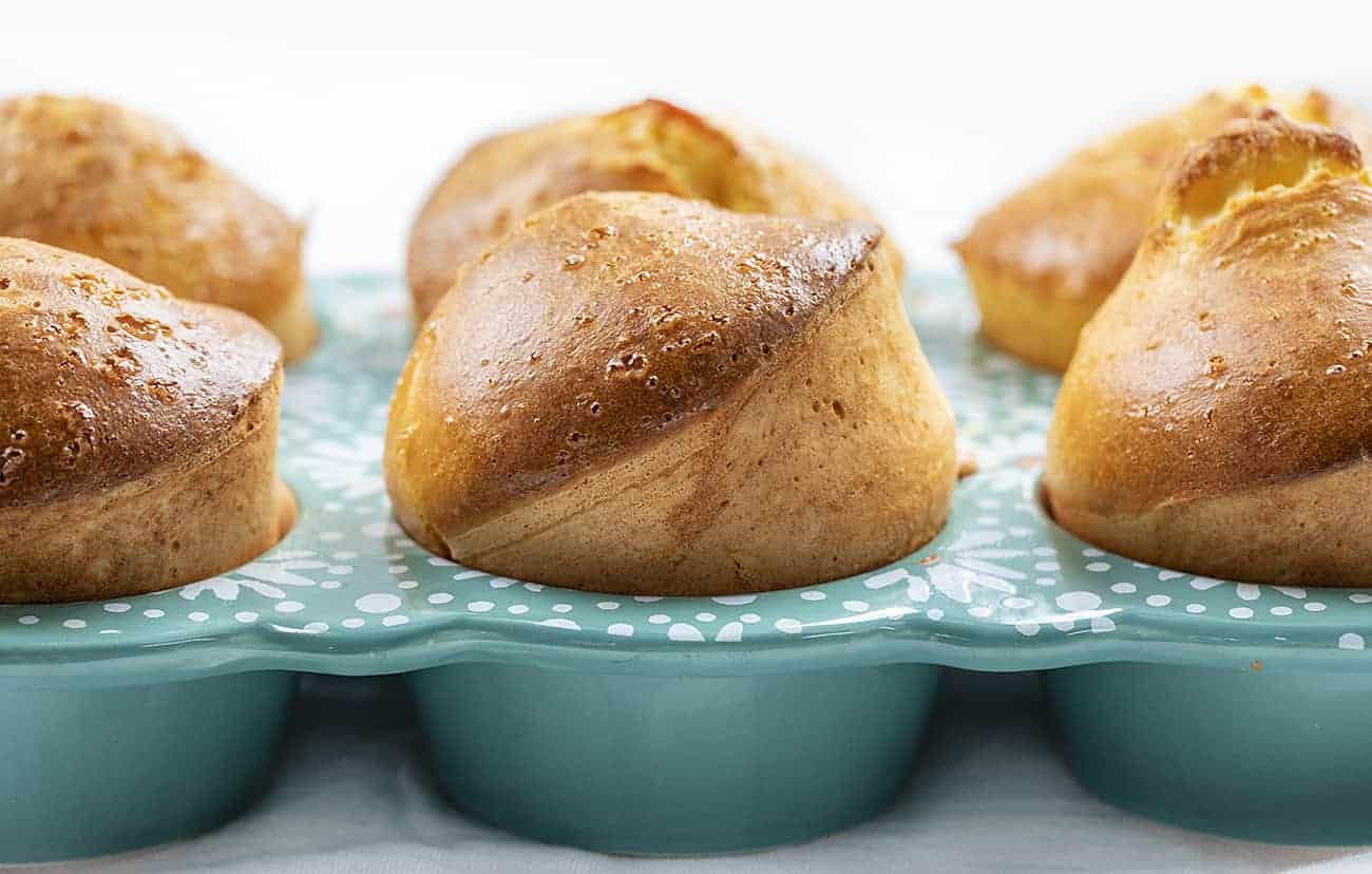 Sourdough Popovers are made with just a few simple ingredients, along with my sourdough starter to give you a light, fluffy roll you can enjoy anytime! Popovers, Homemade Popovers, How to Make Sourdough Popovers, Sourdough Popovers, Popovers in Muffin Pan, Easy Popovers, baking, sourdough recipes ideas, i am baker, iambaker, sourdough Sourdough Popovers Popping Out of Pan