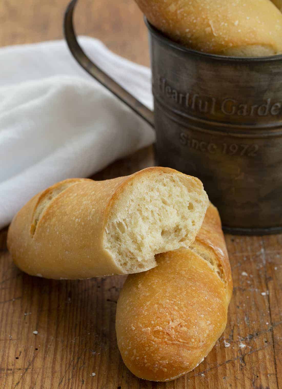 French Baguettes are homemade stick loaves of French bread with a crispy crust and soft, chewy texture baked to a golden brown. Baguettes, French Bread, How to Make Baguettes, Baking, Bread Making, recipes, i am baker, iambaker, appetizers Halved French Baguette