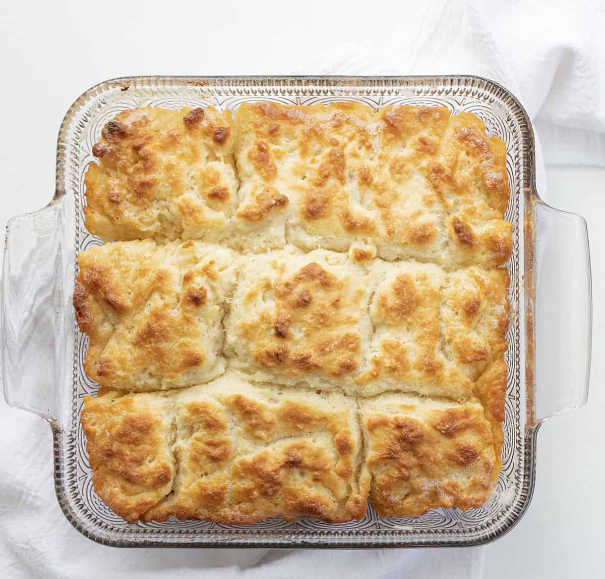 Butter Swim Biscuits are buttermilk biscuits that are baked drenched in butter for a biscuit that has a crispy crust with a soft and fluffy inside. Biscuits, Biscuit Recipe, Recipes, Baking, Soft Biscuits, Butter Biscuits, i am baker, iambaker Overhead of Baked Butter Swim Biscuits